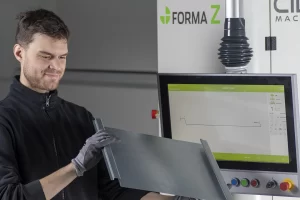 operator checking the result after folding a metal sheet with a cidan folding machine